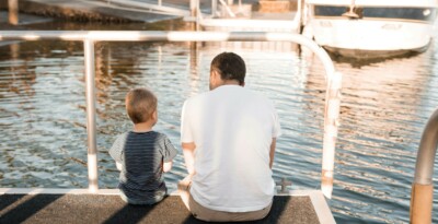 Father and son on jetty